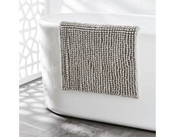 https://s3-ap-southeast-2.amazonaws.com/fusionfactory.commerceconnect.bbnt.production/pim_media/000/174/129/M_F_S24-25_Summer_LS_Studio_Bathmats-Bobble_Melange_BM_Charcoal.jpg?1729811912