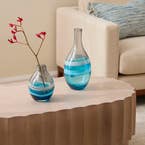 https://s3-ap-southeast-2.amazonaws.com/fusionfactory.commerceconnect.bbnt.production/pim_media/000/174/875/E-Comm_S24-25_Summer_LS_Studio-Decorator_Glass_Vases_Mountain_View-Blue-Grey_SI.jpg?1730253967