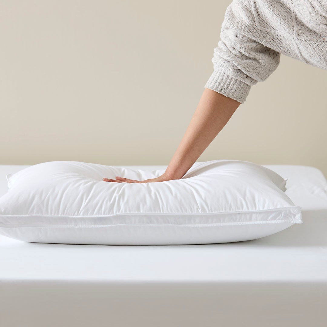 https://s3-ap-southeast-2.amazonaws.com/fusionfactory.commerceconnect.bbnt.production/pim_media/000/172/863/M_F_S24-25_Cat-Stacks_Pillow_Firmness_Test_Luxury_Goose_Surround_SI.jpg?1729057783